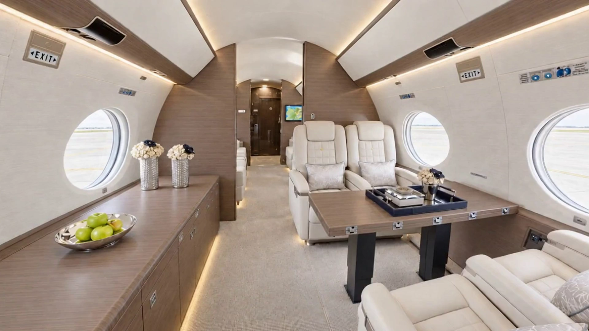 Flowers and a service tray in a private jet lounge