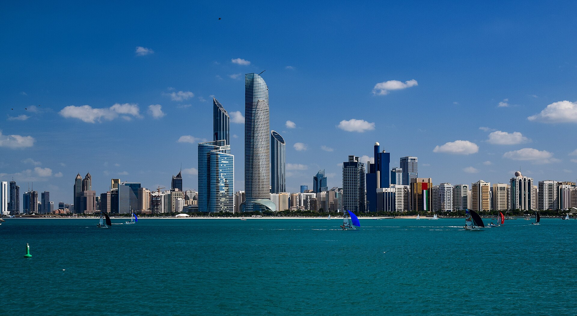 Abu Dhabi’s waterfront skyline across turquoise water