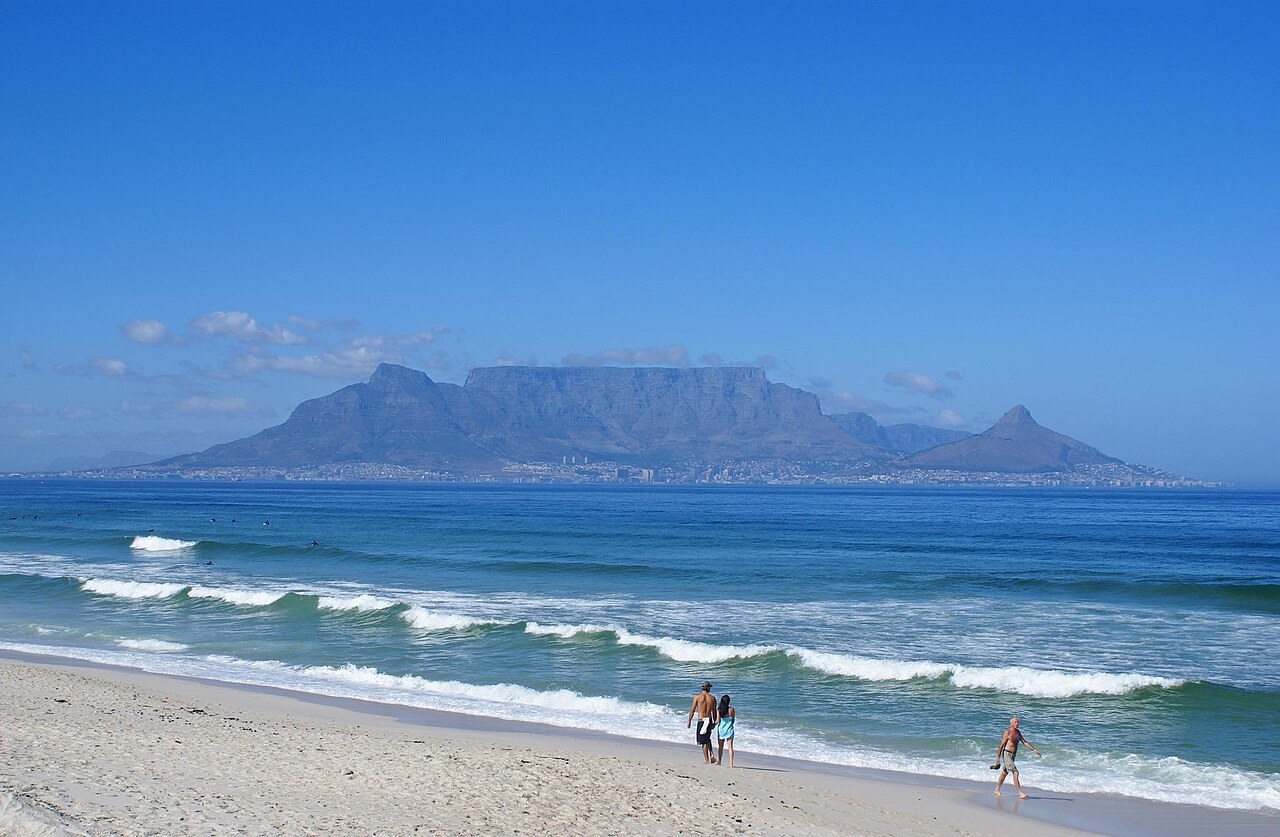 Table Mountain across the bay from a Cape Town beach
