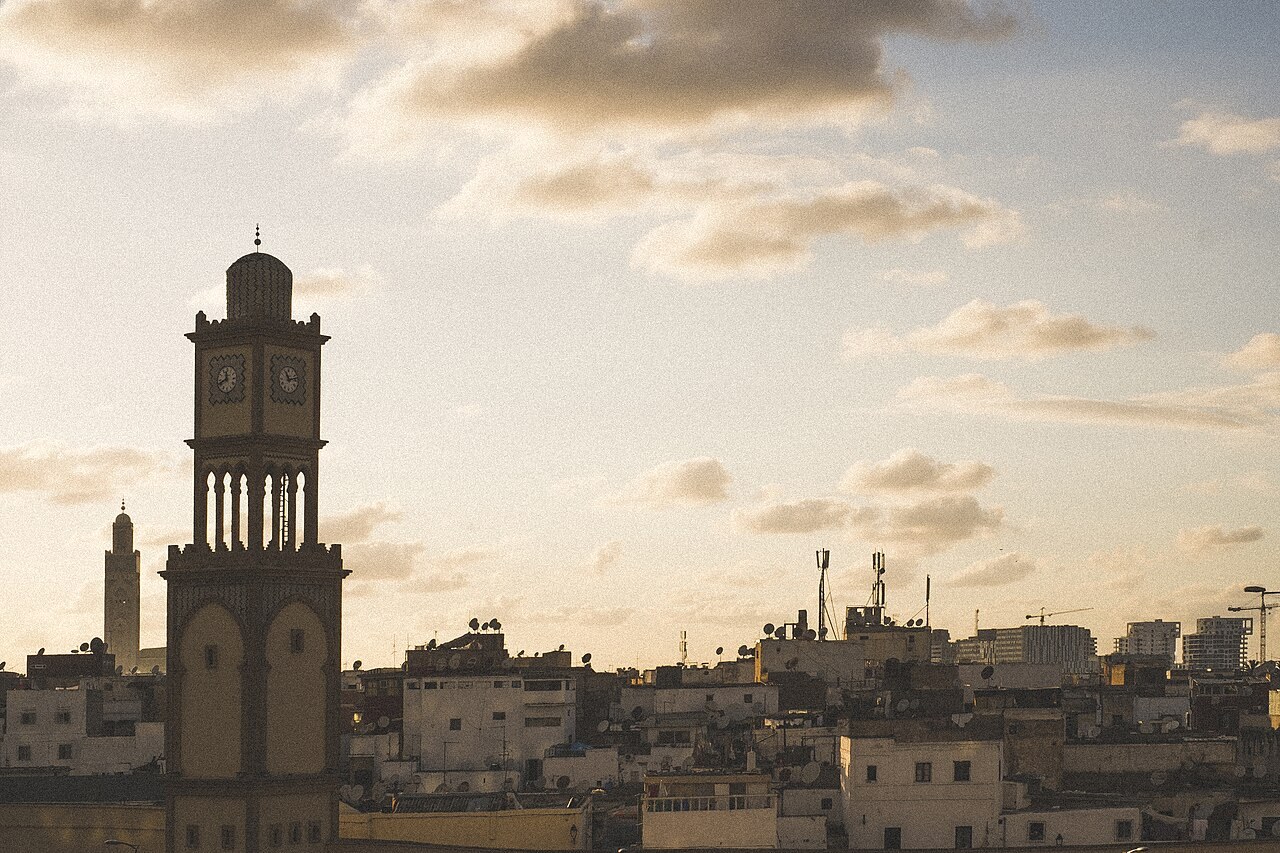 The clock tower and rooftops of Casablanca in warm evening light