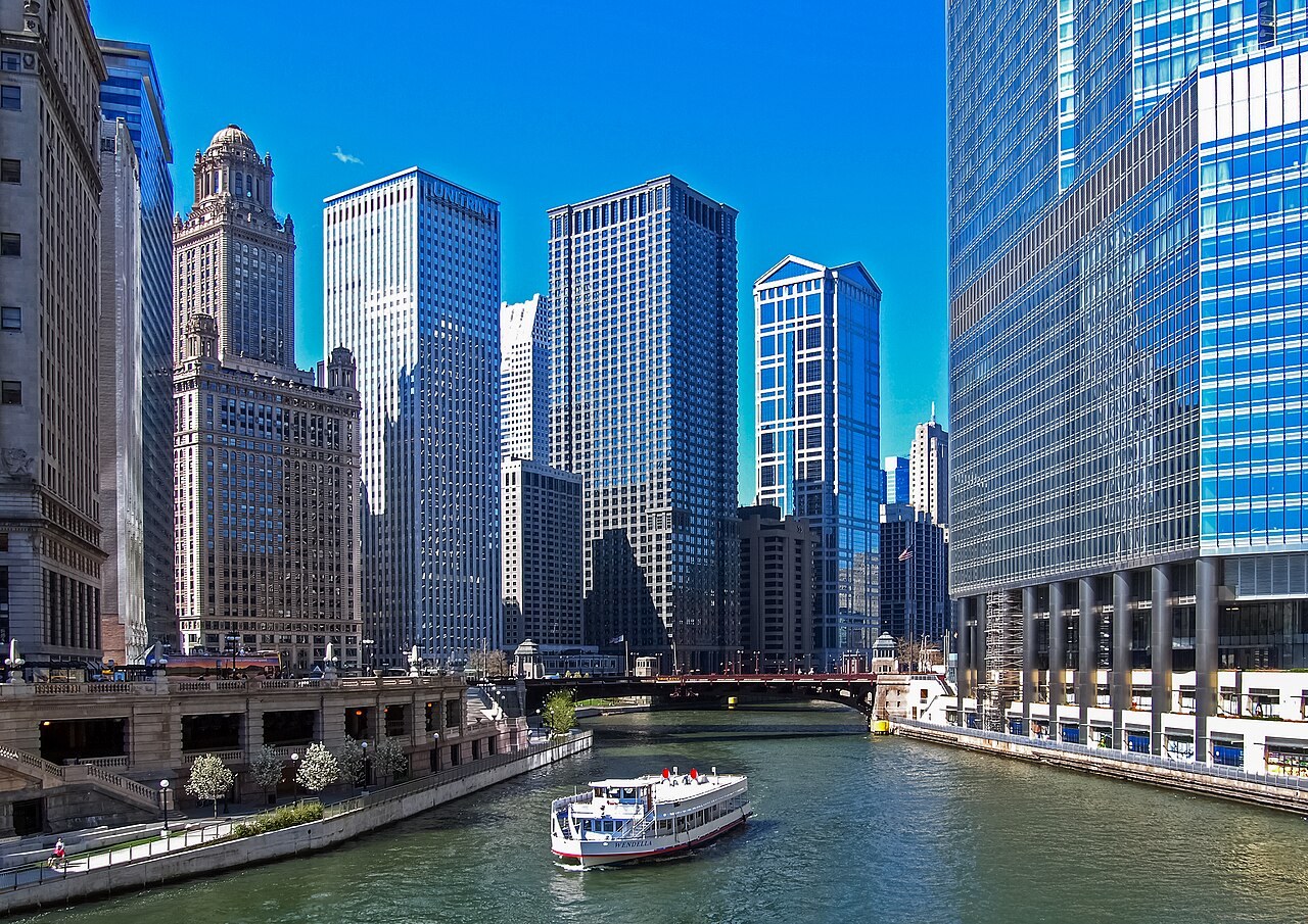 The Chicago River, a sightseeing boat and downtown skyscrapers