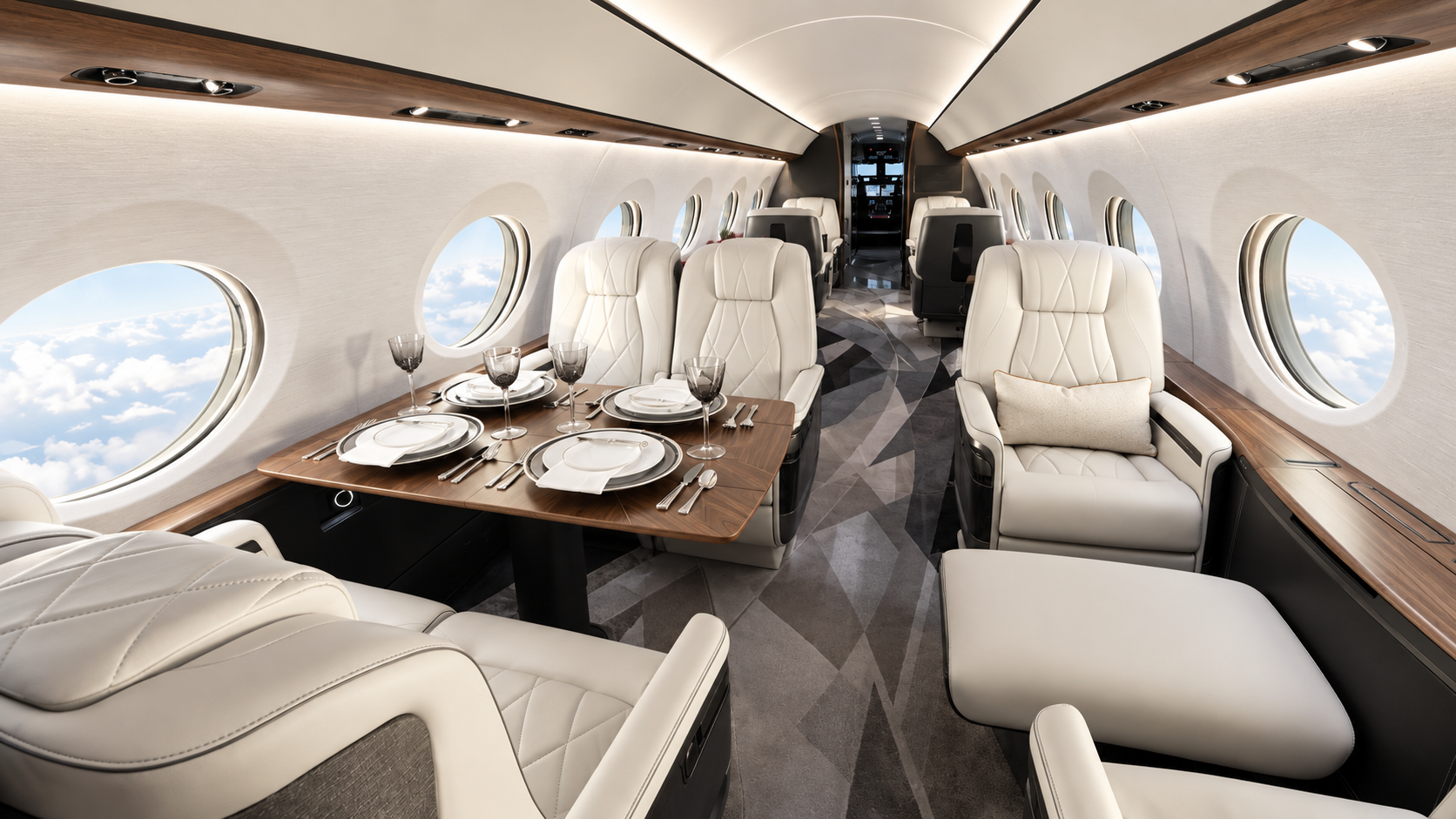 A light private jet cabin with cream leather seats, a dining table and warm wood details
